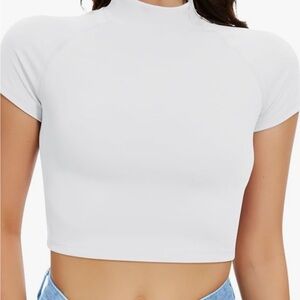 Cropped, high neck, white top.